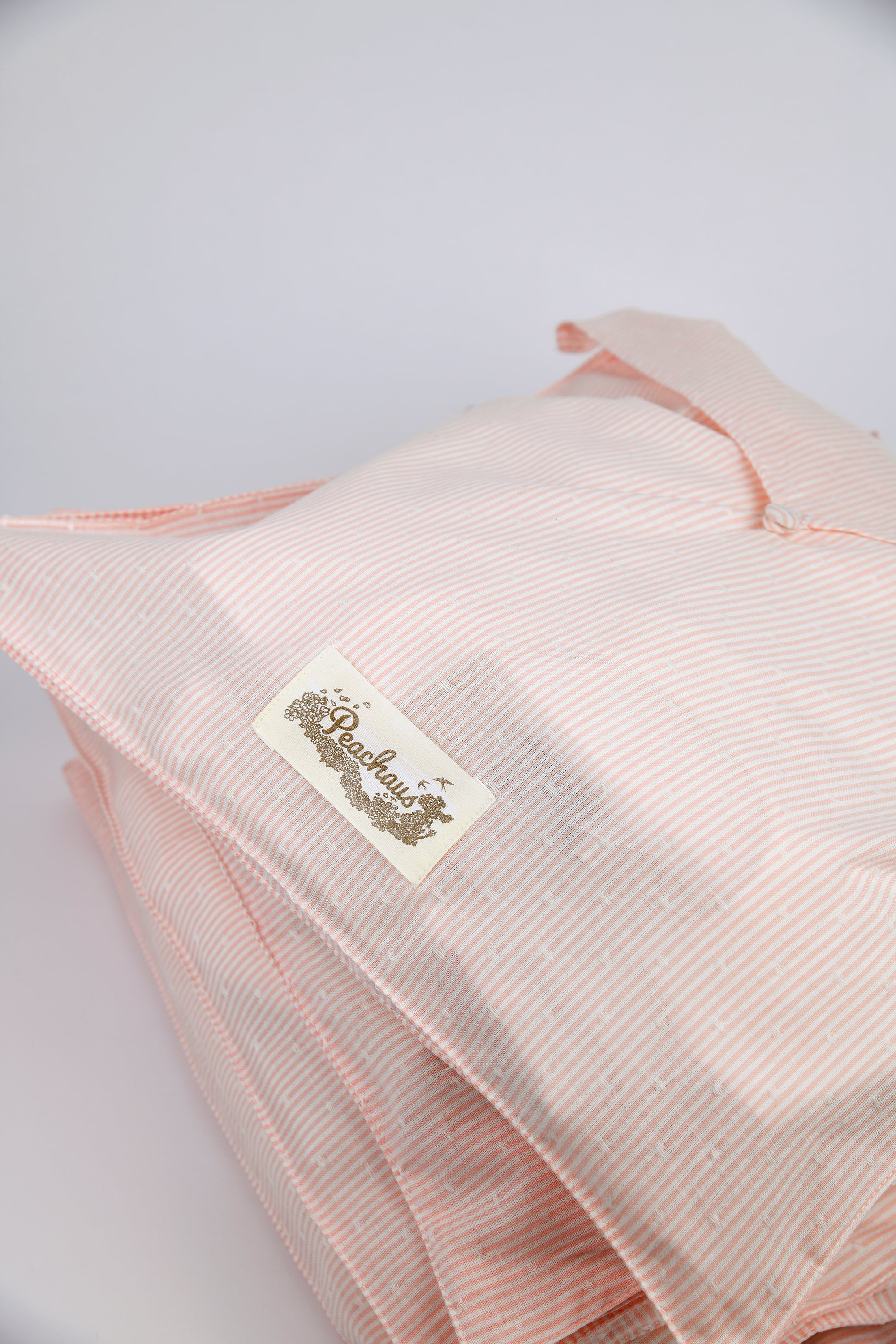 Olearia ethical-cotton pyjama case - Dawnlight Coral